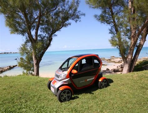 Find out how to rent an electric car in Bermuda from four different companies that offer mini electric cars with various features and charging locations. Compare prices, distances, amenities, and space for bags. Contact the car rental companies directly for more information and discounts. 